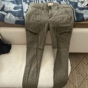 Army green skinny jeans.